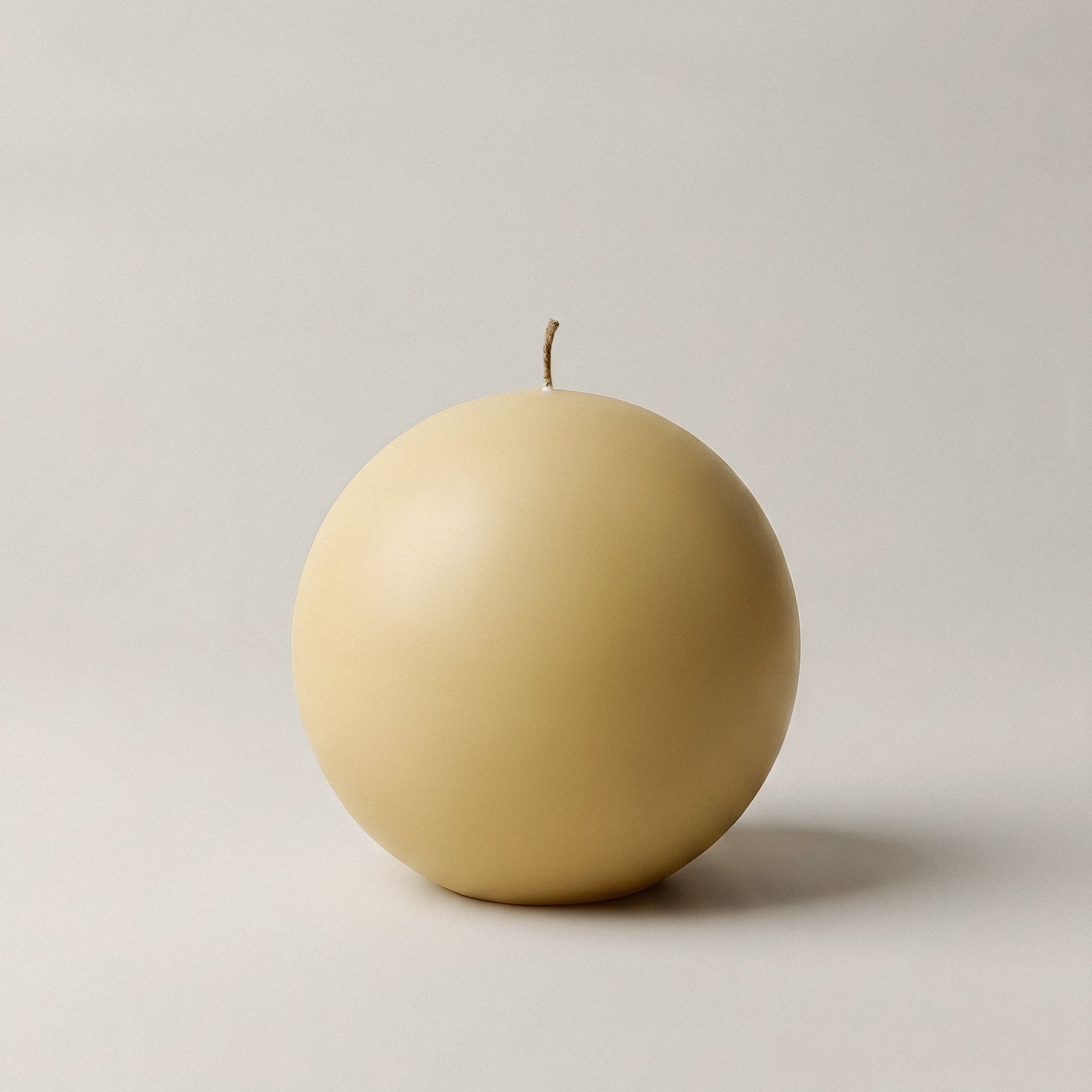 Handmade sphere sculptural candle detail showing smooth soy wax texture and minimalist design from Los Angeles