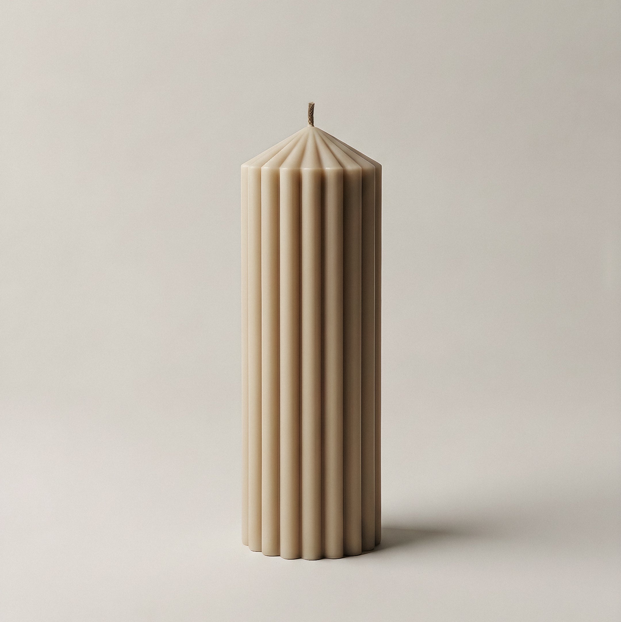 Peak sculptural candle handmade in Los Angeles displayed in modern interior with natural lighting and minimal decor