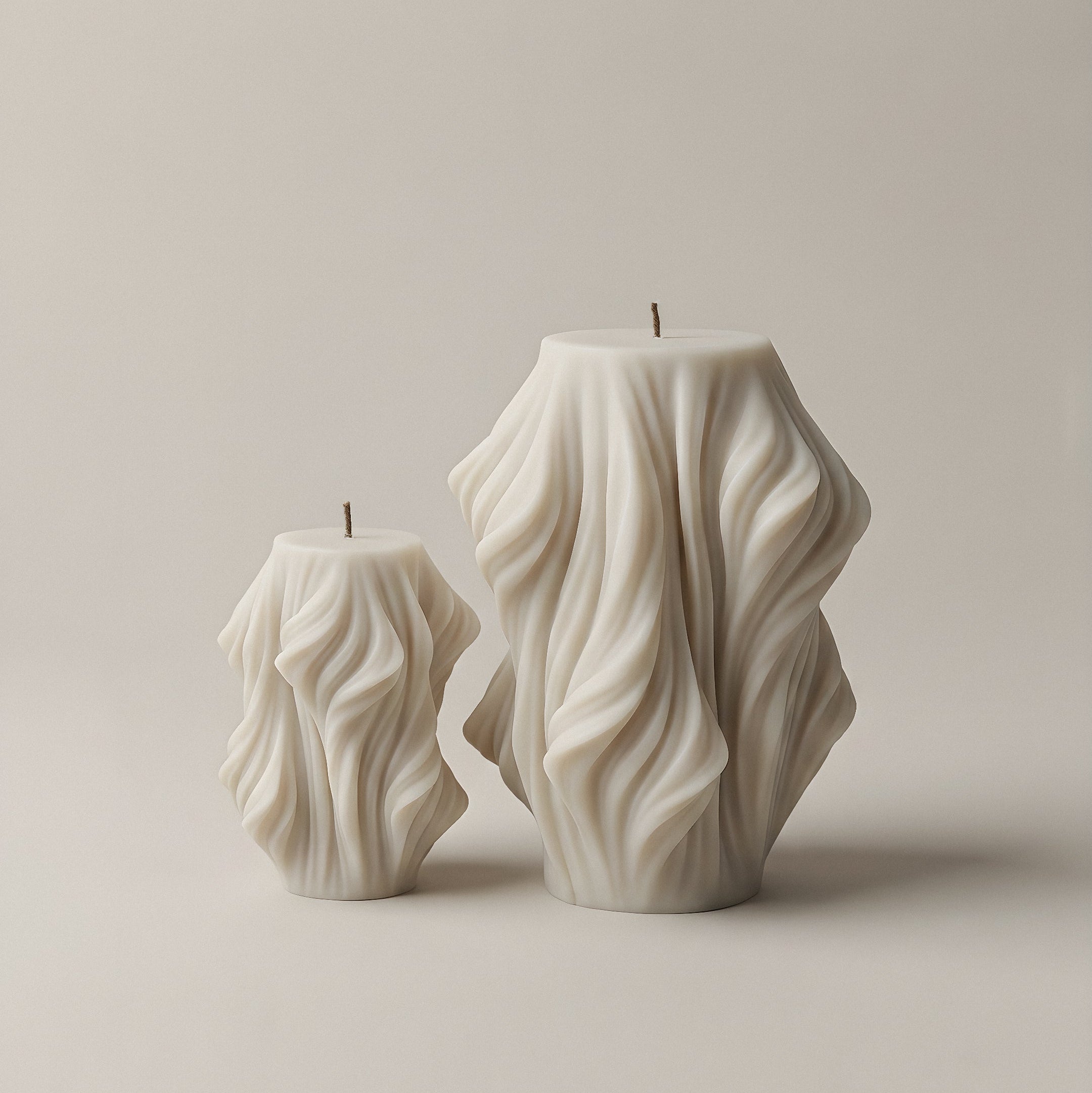 Close-up detail of handmade sculptural candle with cascading wave texture in premium soy wax from Los Angeles