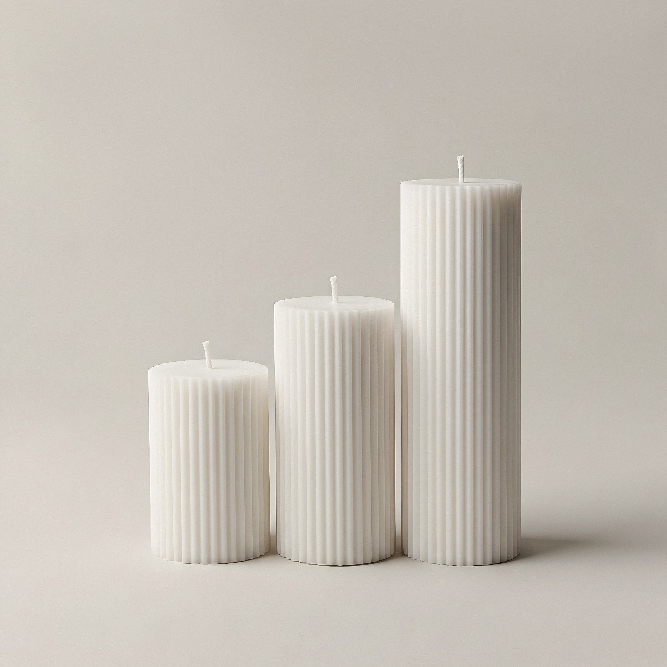 Close-up detail of handmade ribbed sculptural candle texture showing premium soy wax crafted in Los Angeles
