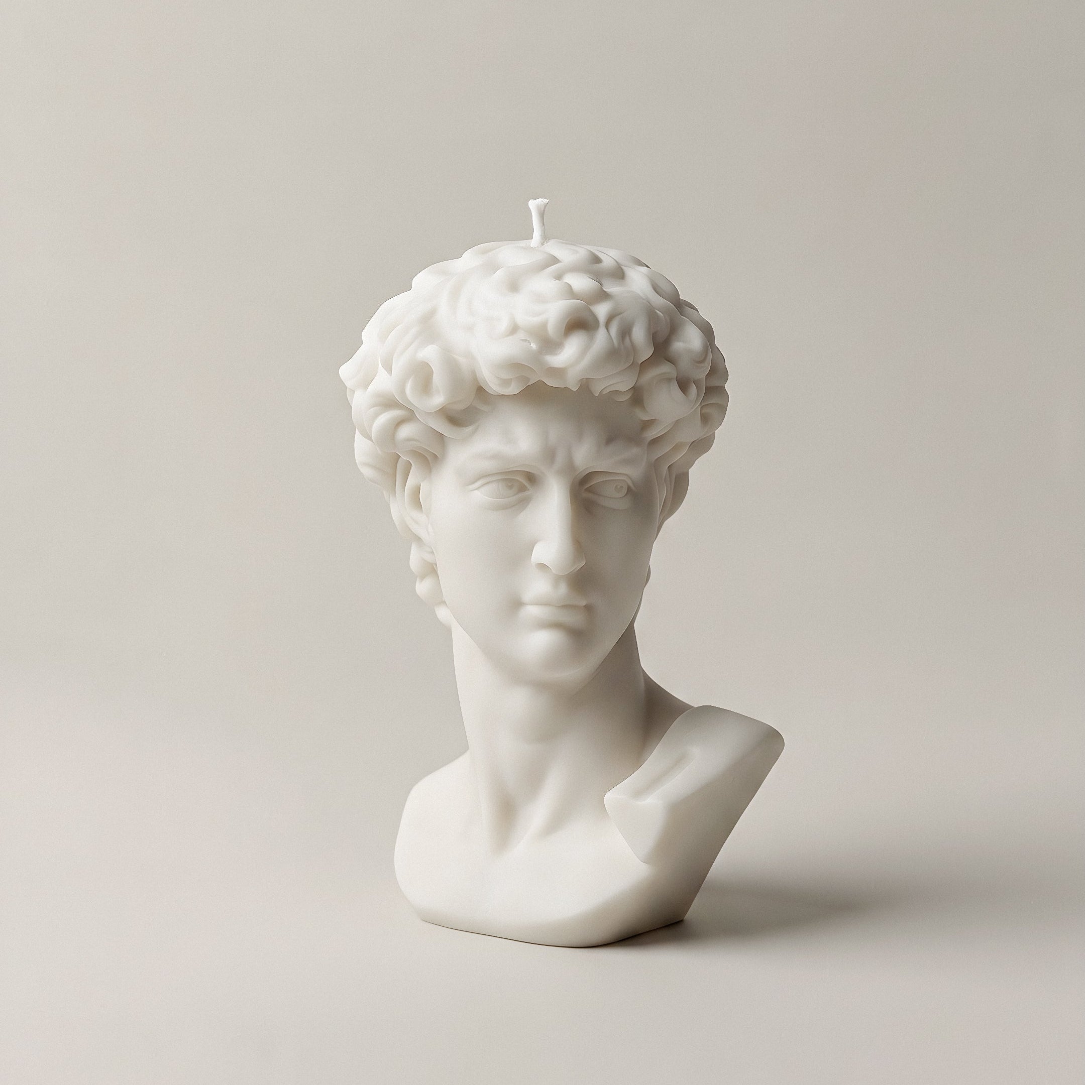 Close-up detail of handmade David bust sculptural candle showing premium soy wax texture and craftsmanship