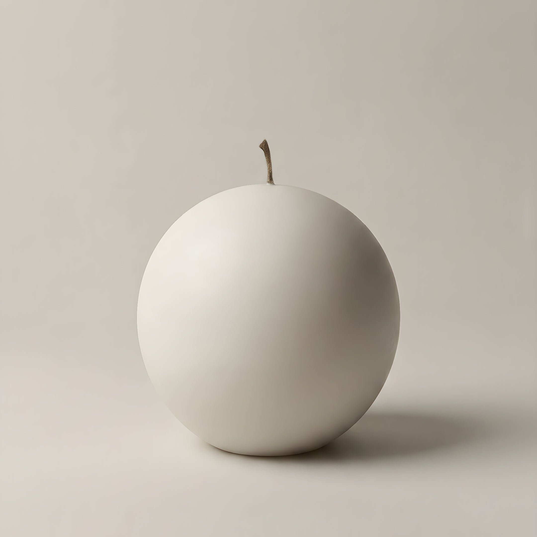 Handmade sphere sculptural candle detail showing smooth soy wax texture on minimalist surface in Los Angeles studio