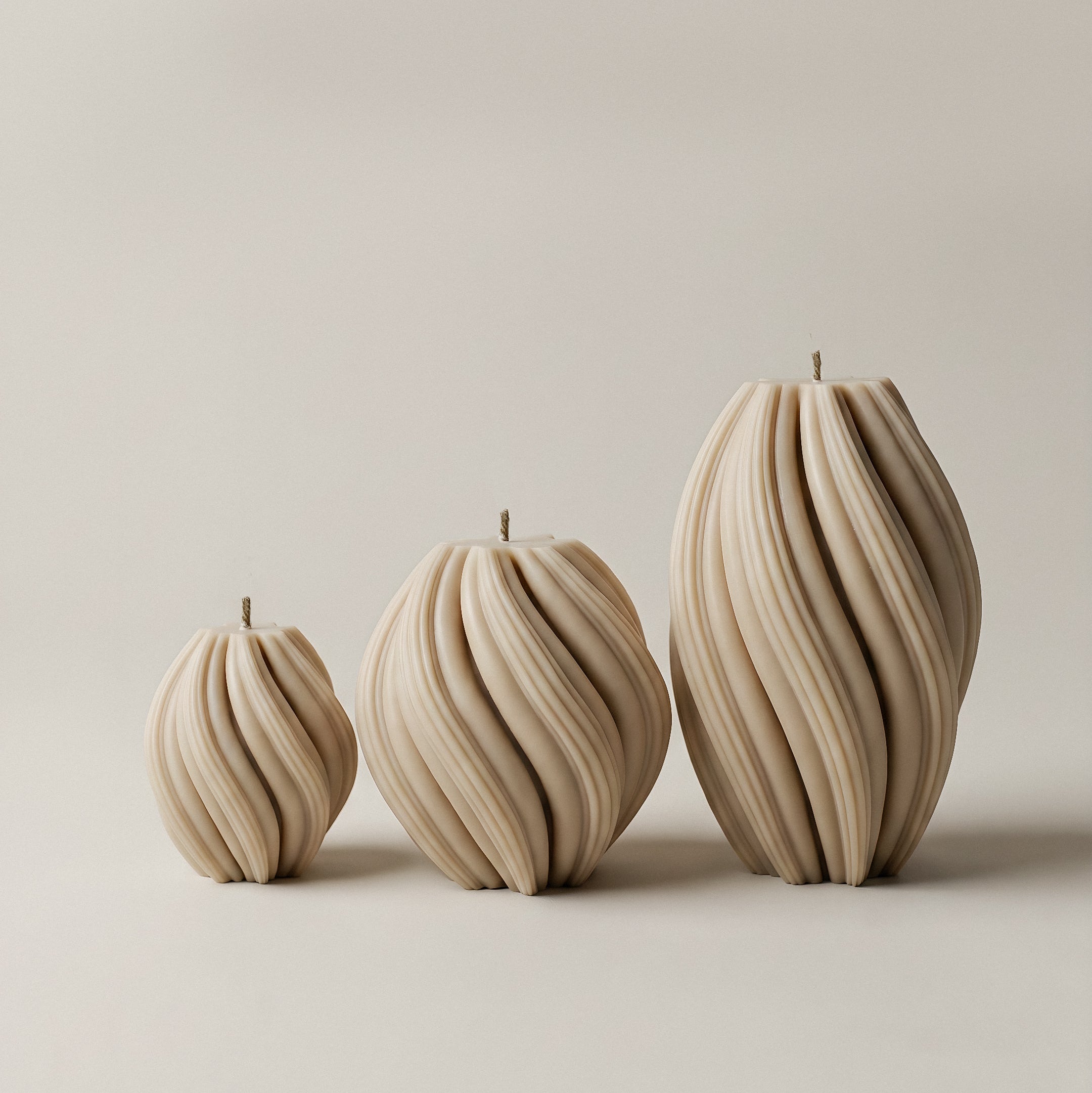 Handmade unscented swirl sculptural candle detail showing premium soy wax texture and organic curves in natural light