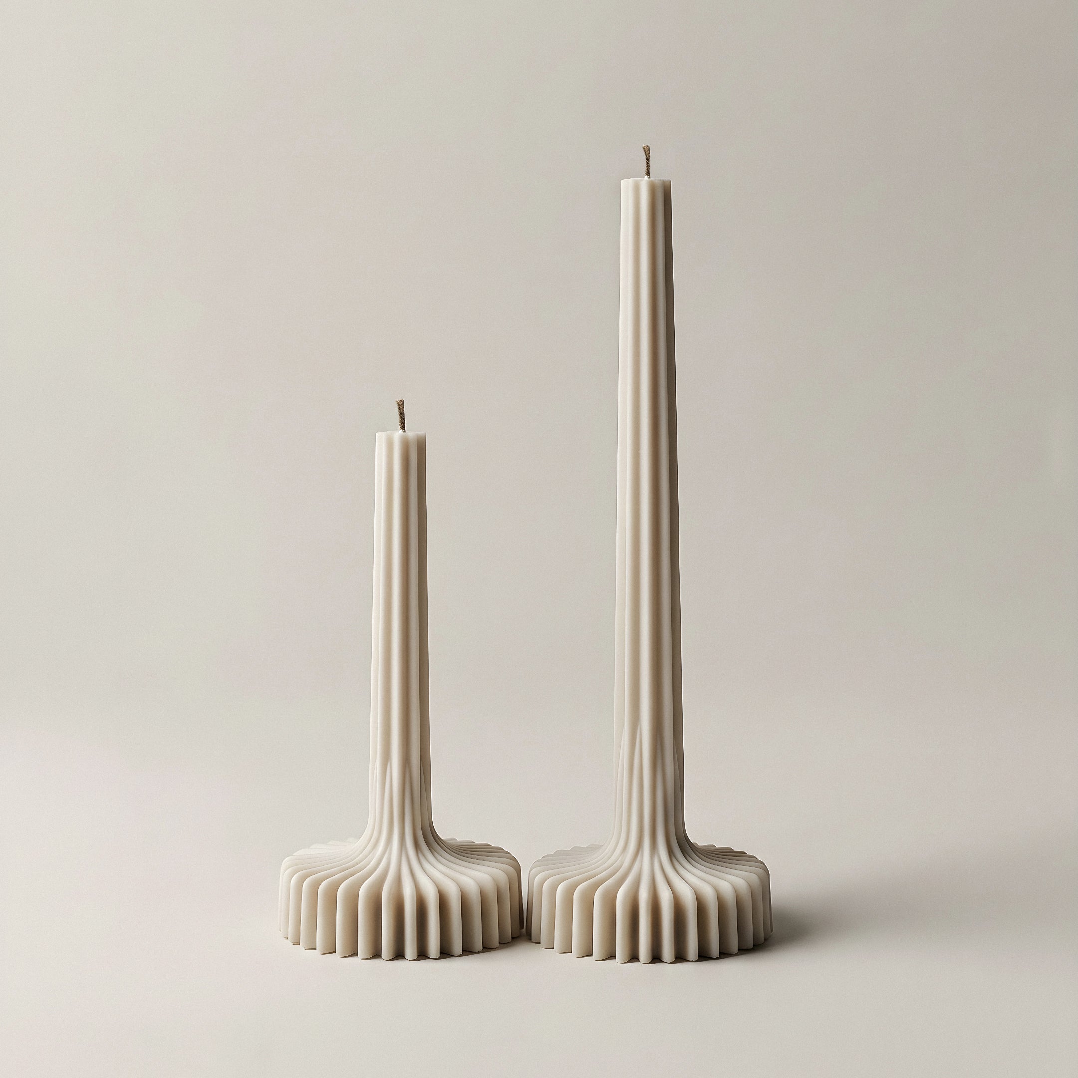Close-up of handmade sculptural vase candle showing smooth soy wax texture and natural cotton wick detail