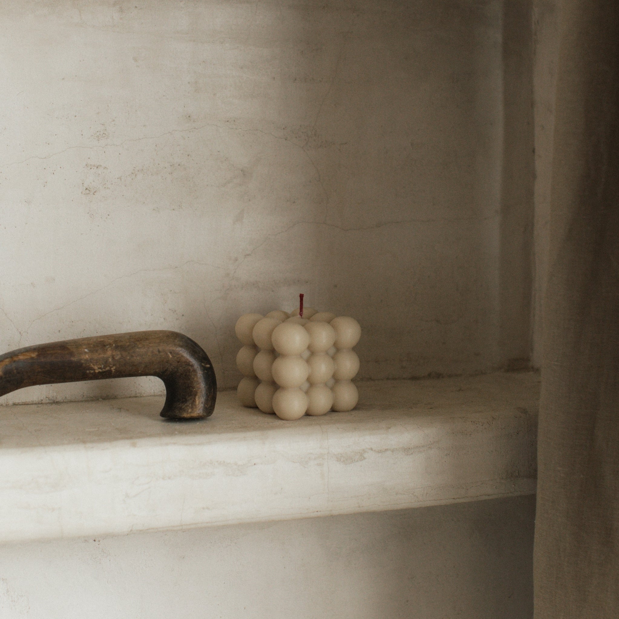 Gray bubble candle by LAWA featuring modern stacked bubble shapes in soy wax