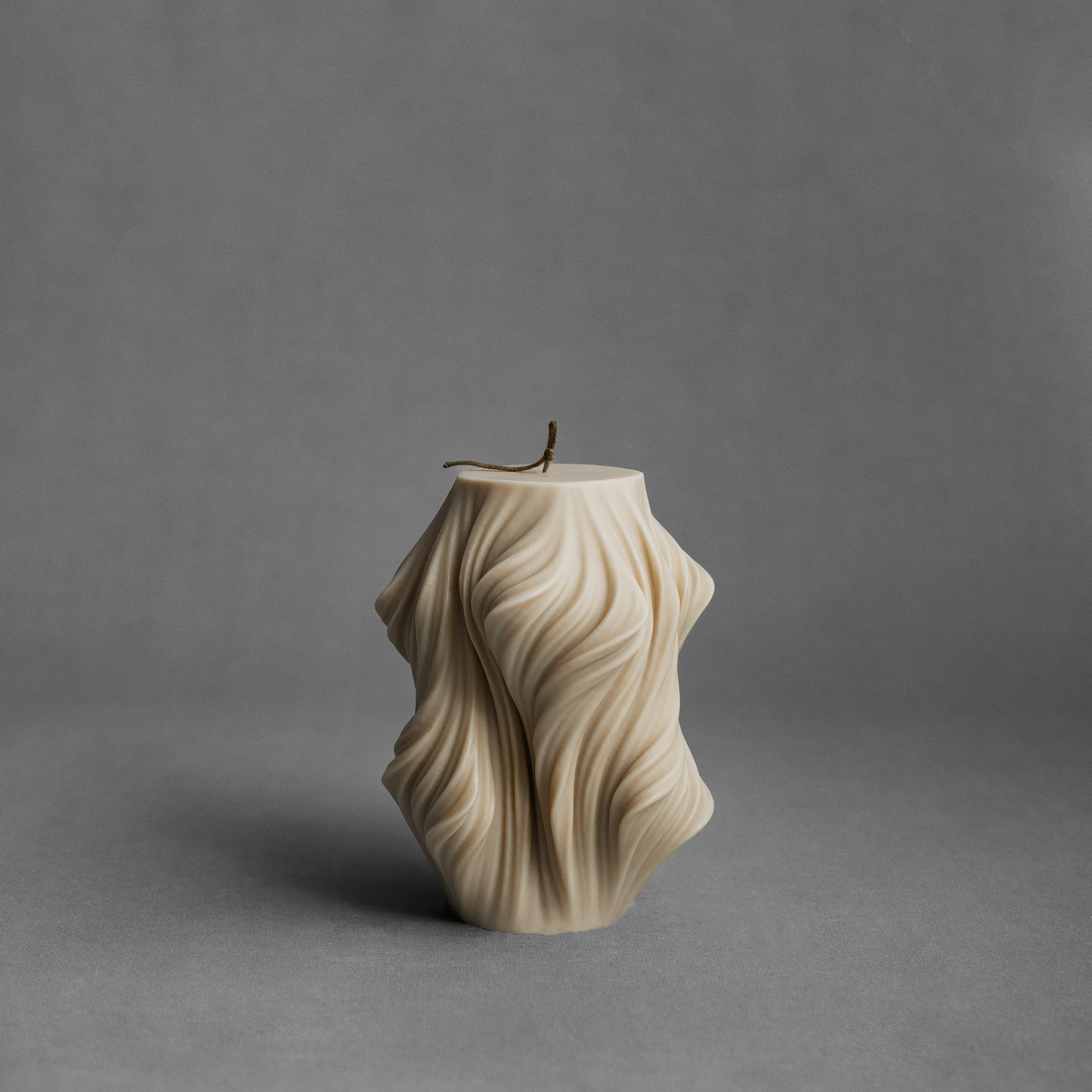 Sandstone cascading large pillar candle by LAWA with warm layered sculptural texture