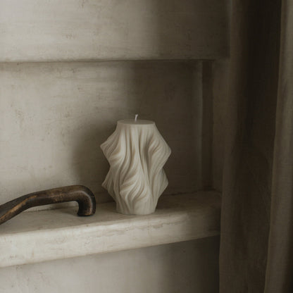 Close-up detail of handmade sculptural candle showing cascading wave texture in premium soy wax from Los Angeles