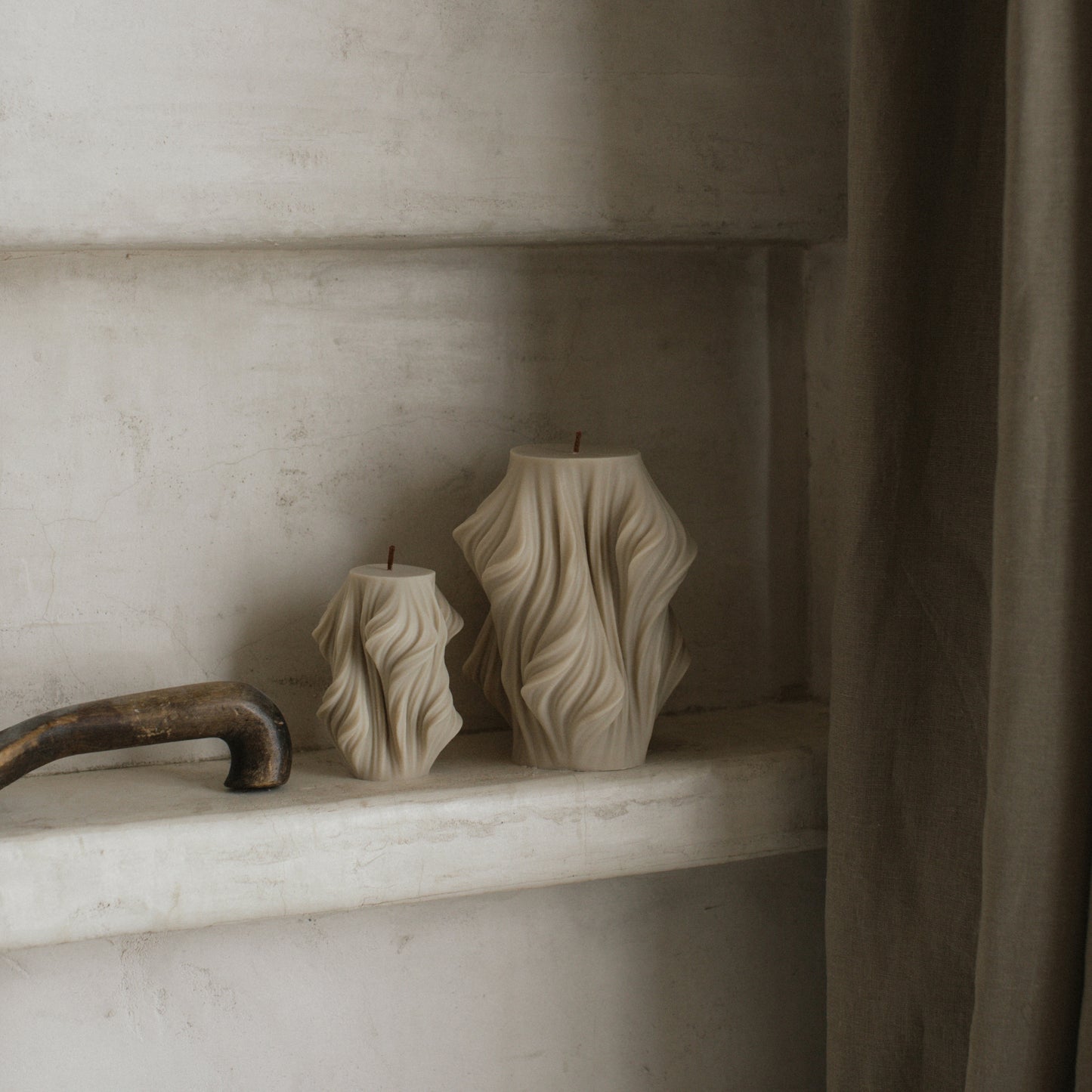 Close-up detail of handmade sculptural candle showing cascading wave texture in premium soy wax made in Los Angeles