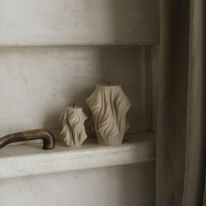 Close-up detail of handmade sculptural candle showing cascading wave texture in premium soy wax made in Los Angeles