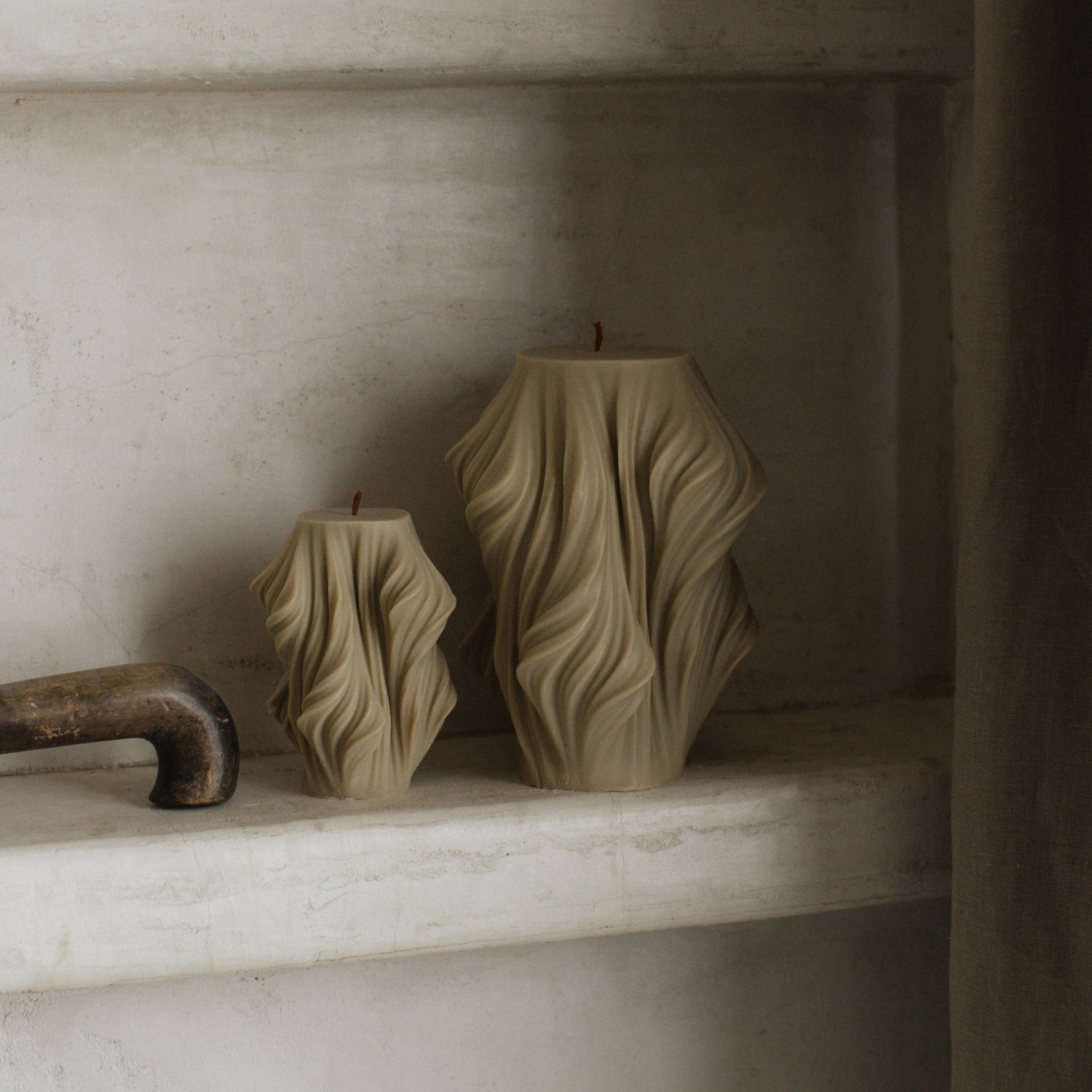 Neutral olive beige cascading pillar candle duo with sculptural geometric design by LAWA