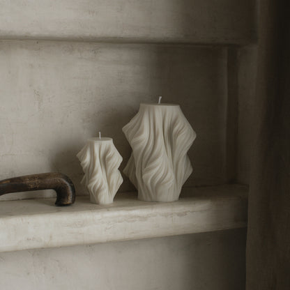 Close-up detail of handmade sculptural candle showing cascading wave texture in premium soy wax from Los Angeles
