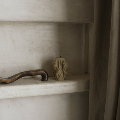 Close-up detail of handmade sculptural candle showing cascading wave texture in premium soy wax from Los Angeles