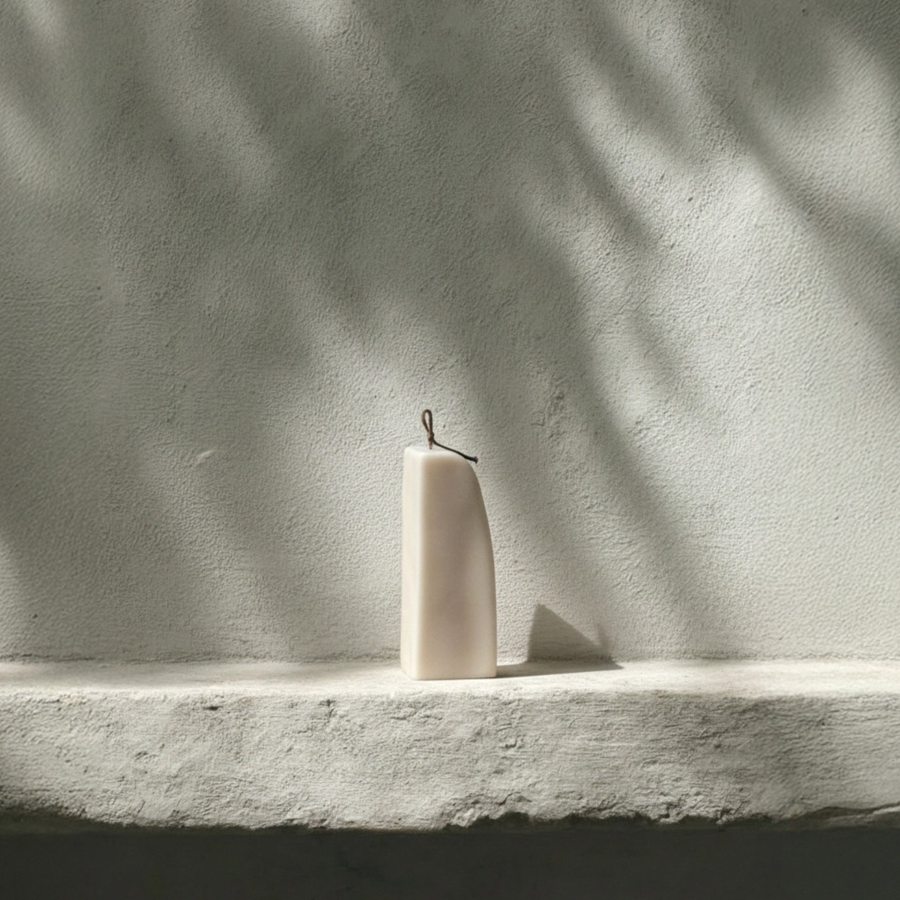 Light beige downhill sculptural soy wax candle by LAWA, modern minimalist decor piece with curved form for minimalistic hoem decor