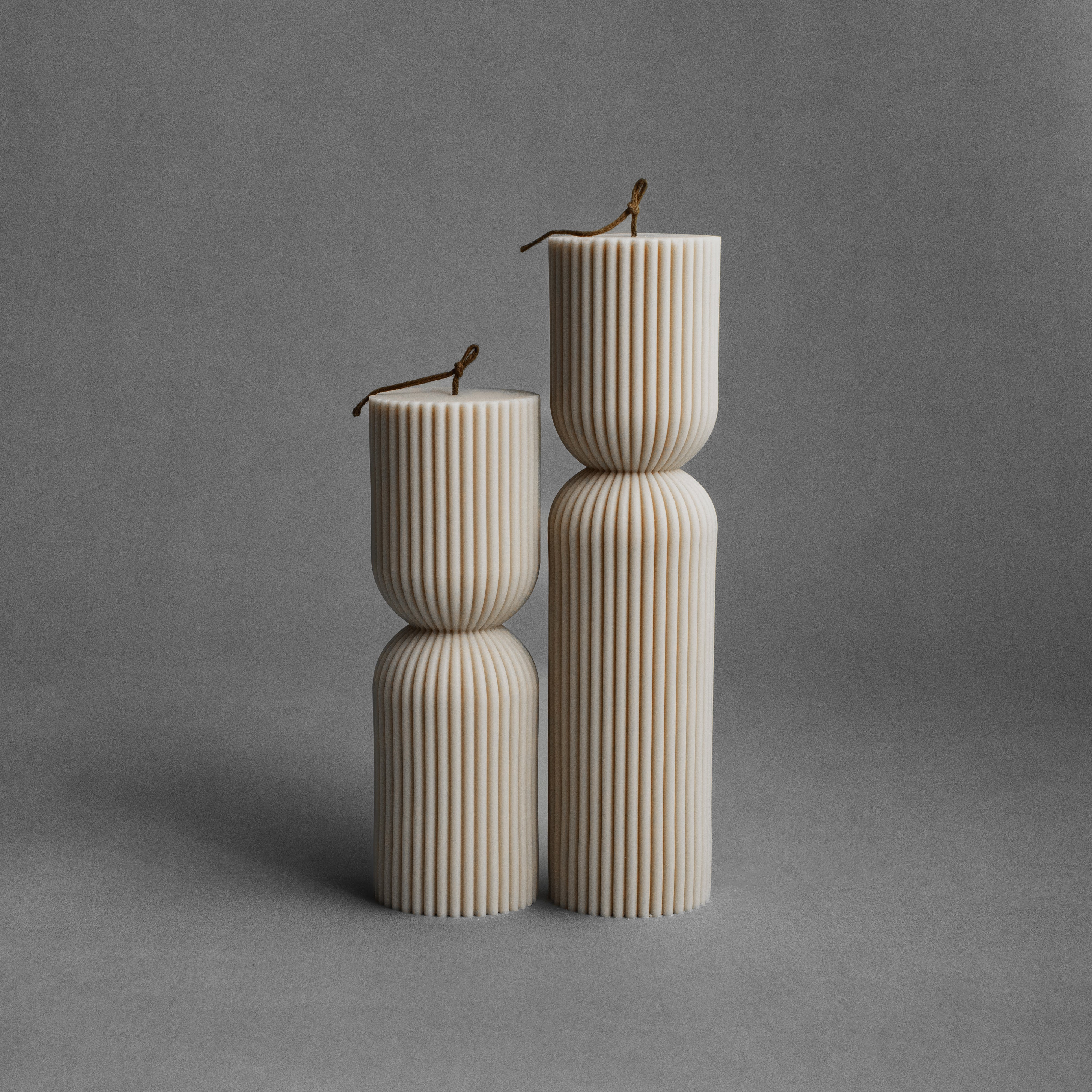 Moon gray hourglass pillar candle set by LAWA with sleek sculptural curves