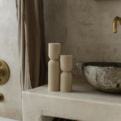 Hourglass sculptural candle in natural soy wax showing curved silhouette detail, handmade in Los Angeles