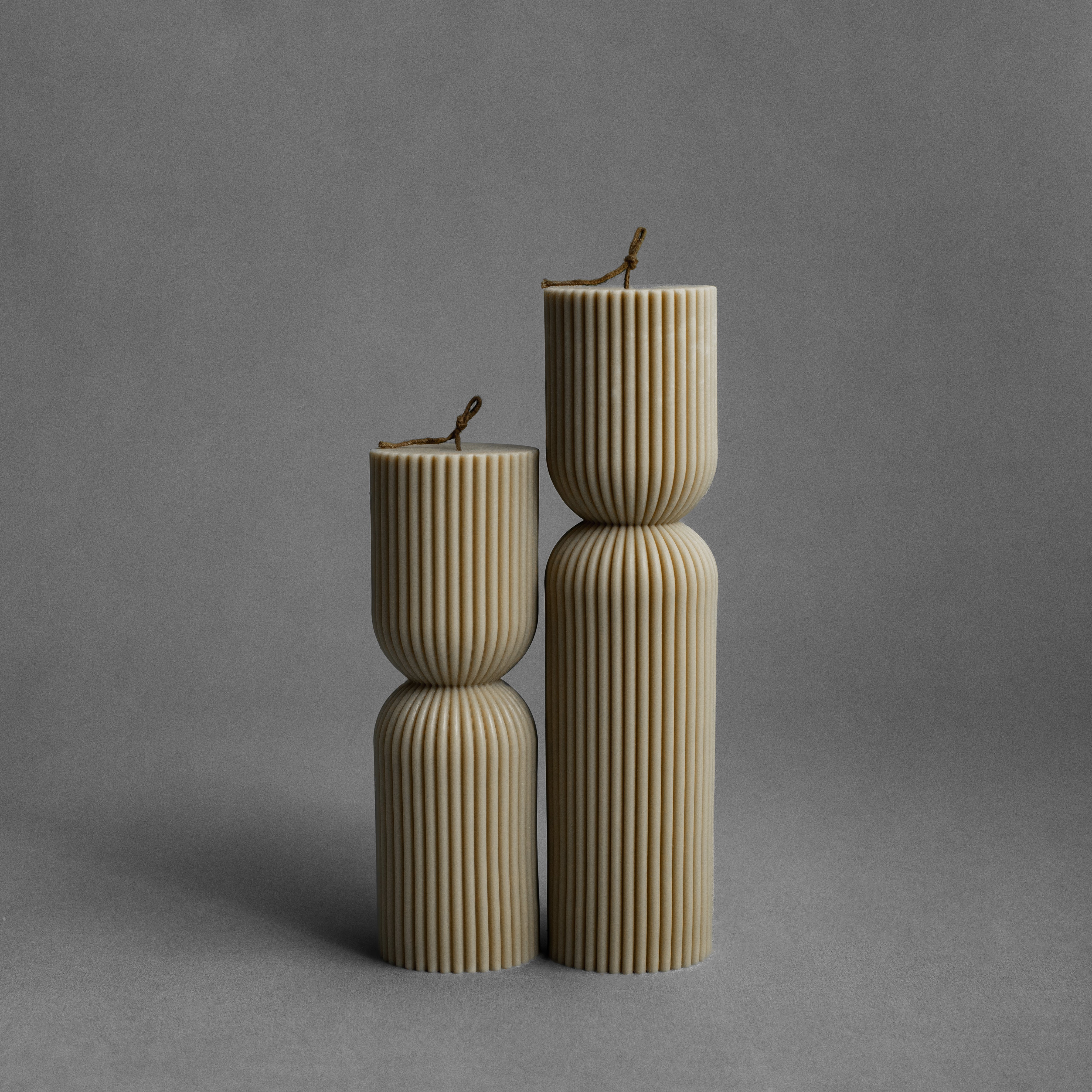 Olive beige hourglass pillar candle set by LAWA with earthy curved design