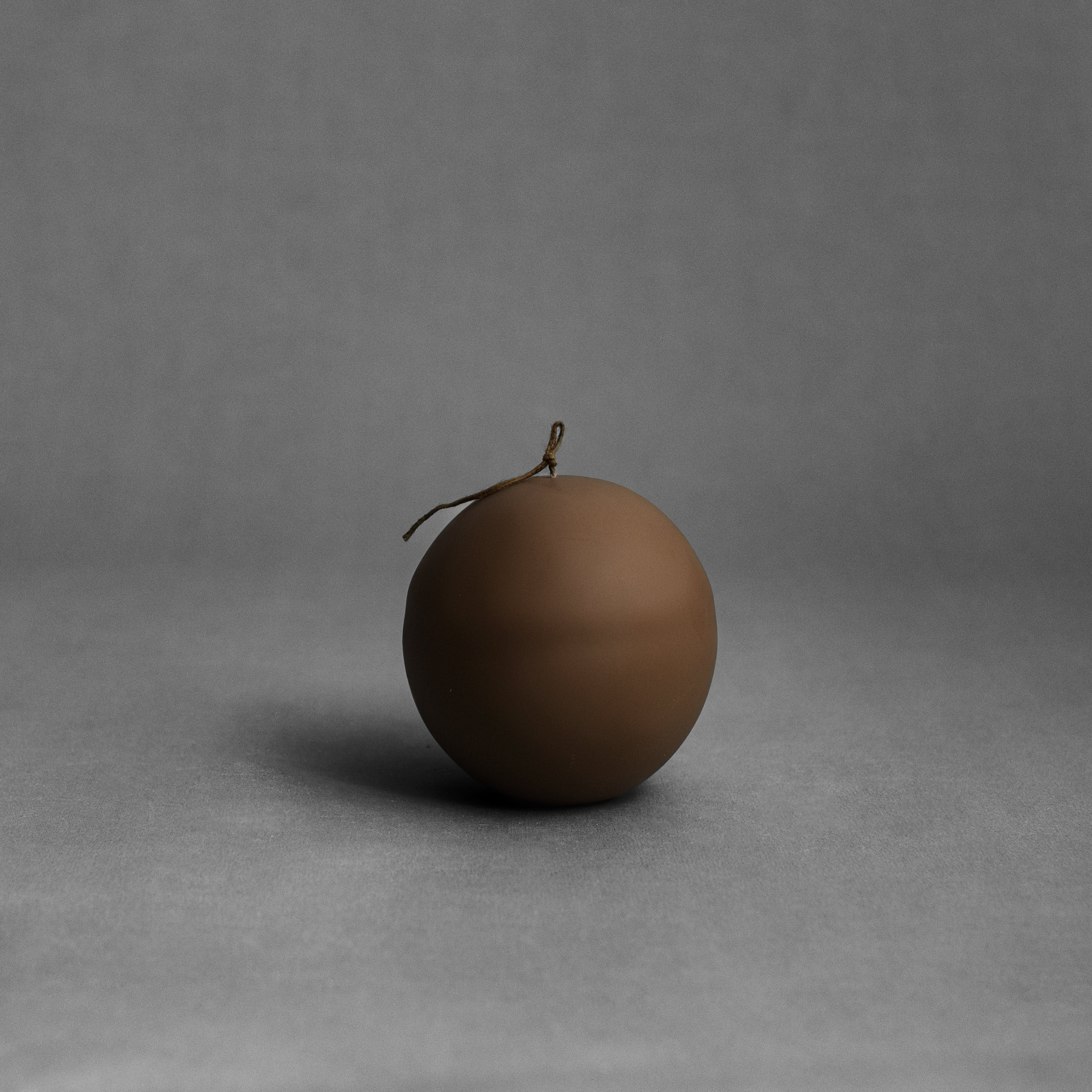 Kobicha brown imperfect sphere soy wax pillar candle by LAWA with handcrafted organic texture