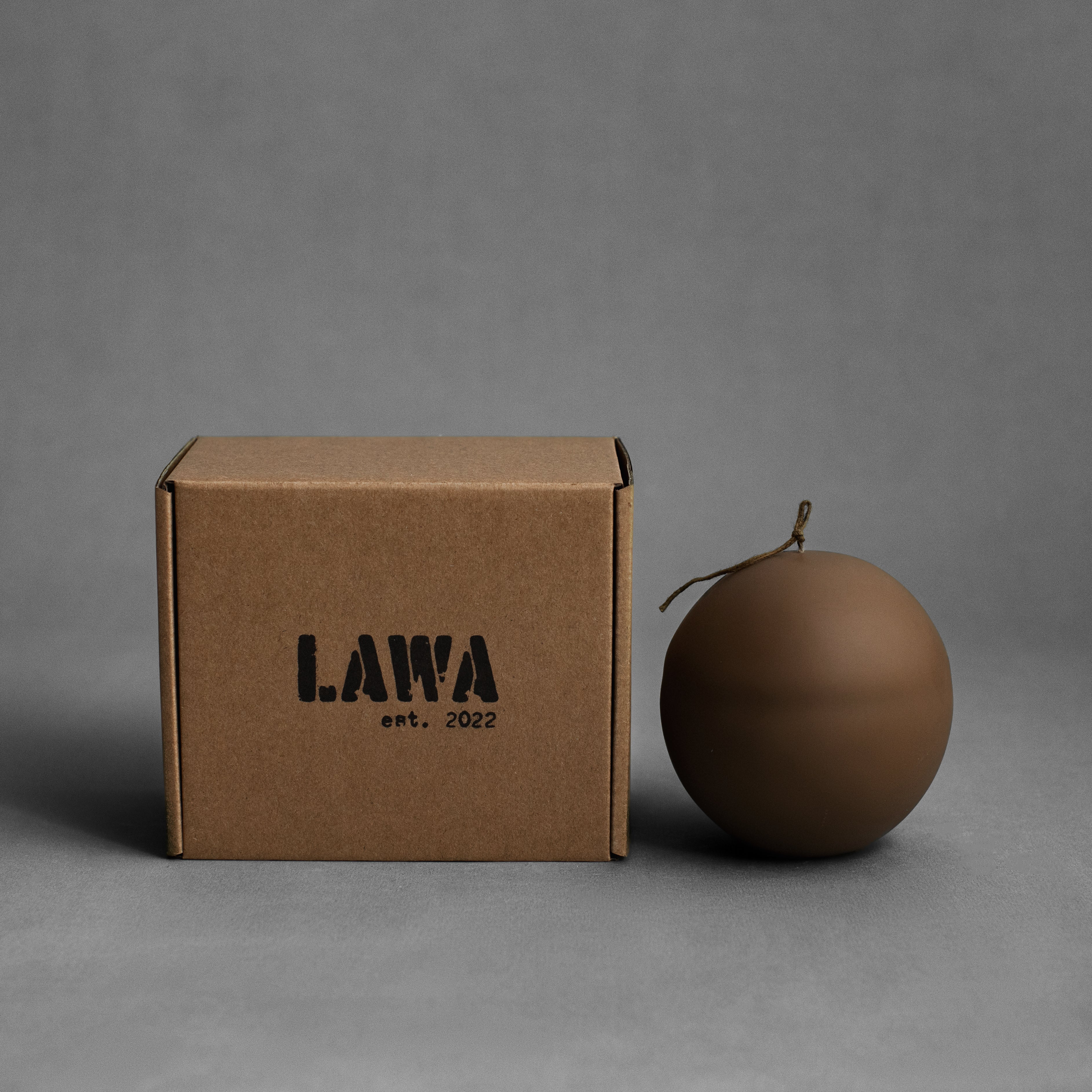 Kobicha brown imperfect sphere soy wax candle by LAWA with handcrafted organic texture with shipping packaging box