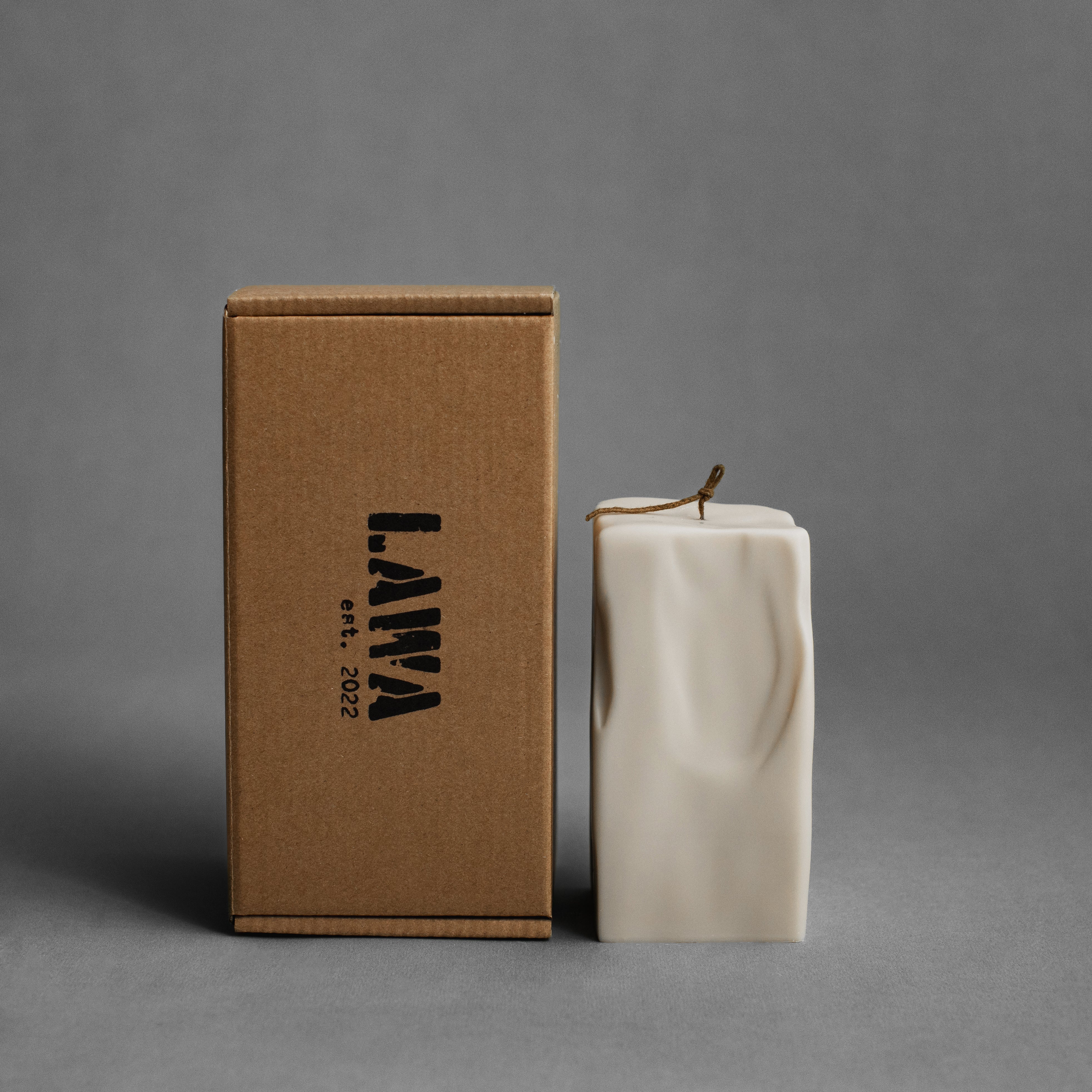 Large light beige raw block soy wax pillar candle by LAWA with sculptural geometric design for minimalist interiordeas part of the set 