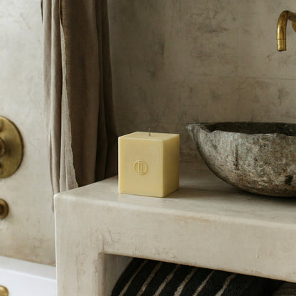 Handmade sculptural block candle made from premium soy wax shown in minimalist Los Angeles home setting