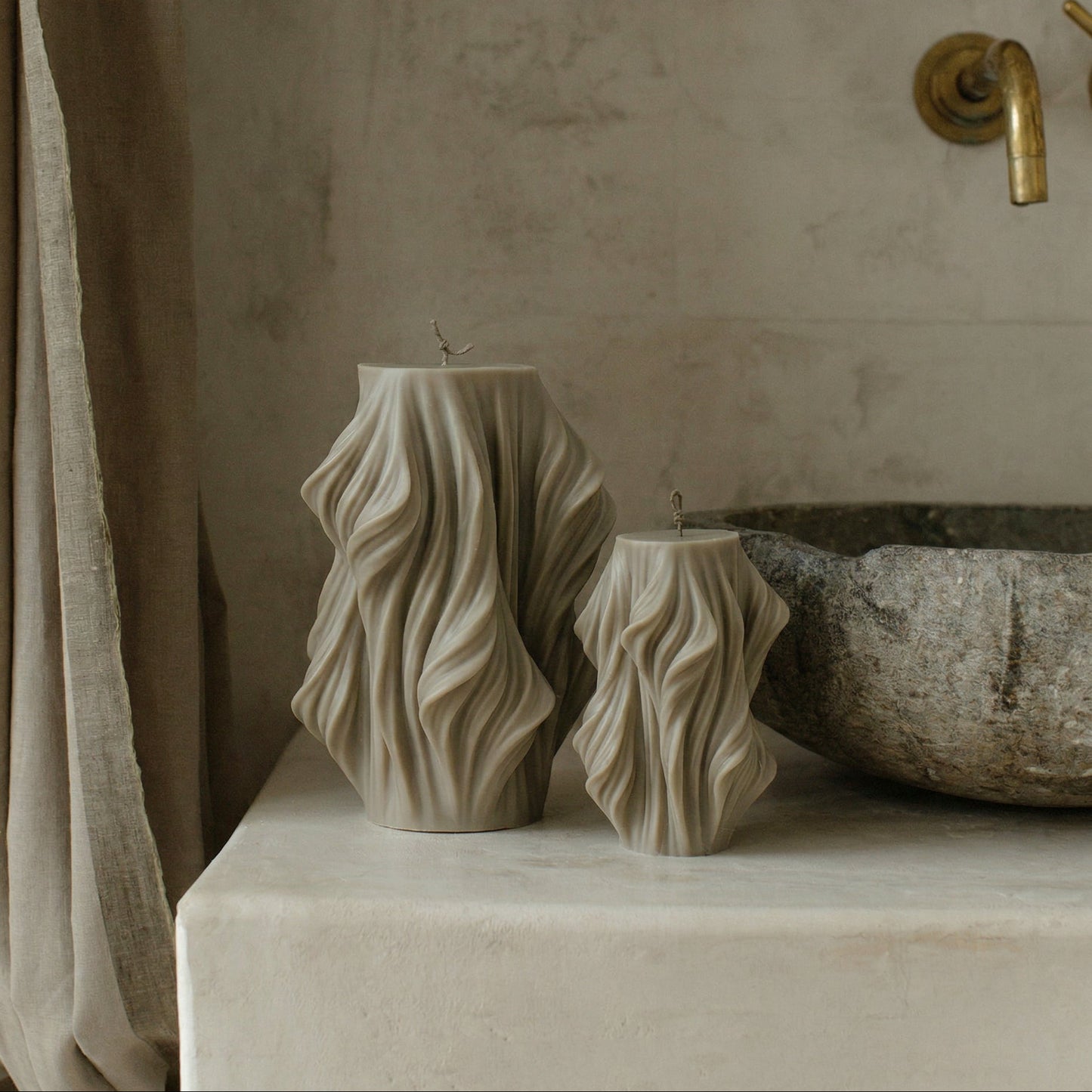 Close-up detail of handmade Cascading Wave sculptural candle showing layered soy wax texture and organic flowing form