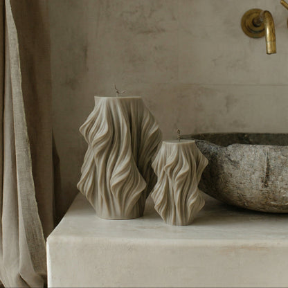 Close-up detail of handmade Cascading Wave sculptural candle showing layered soy wax texture and organic flowing form