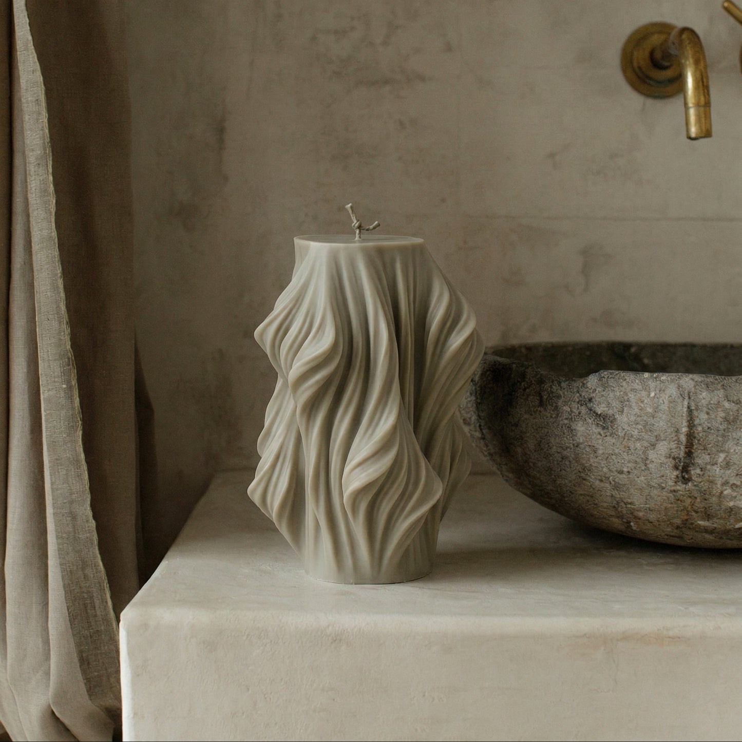 Close-up detail of handmade sculptural candle showing cascading wave texture in premium soy wax from Los Angeles