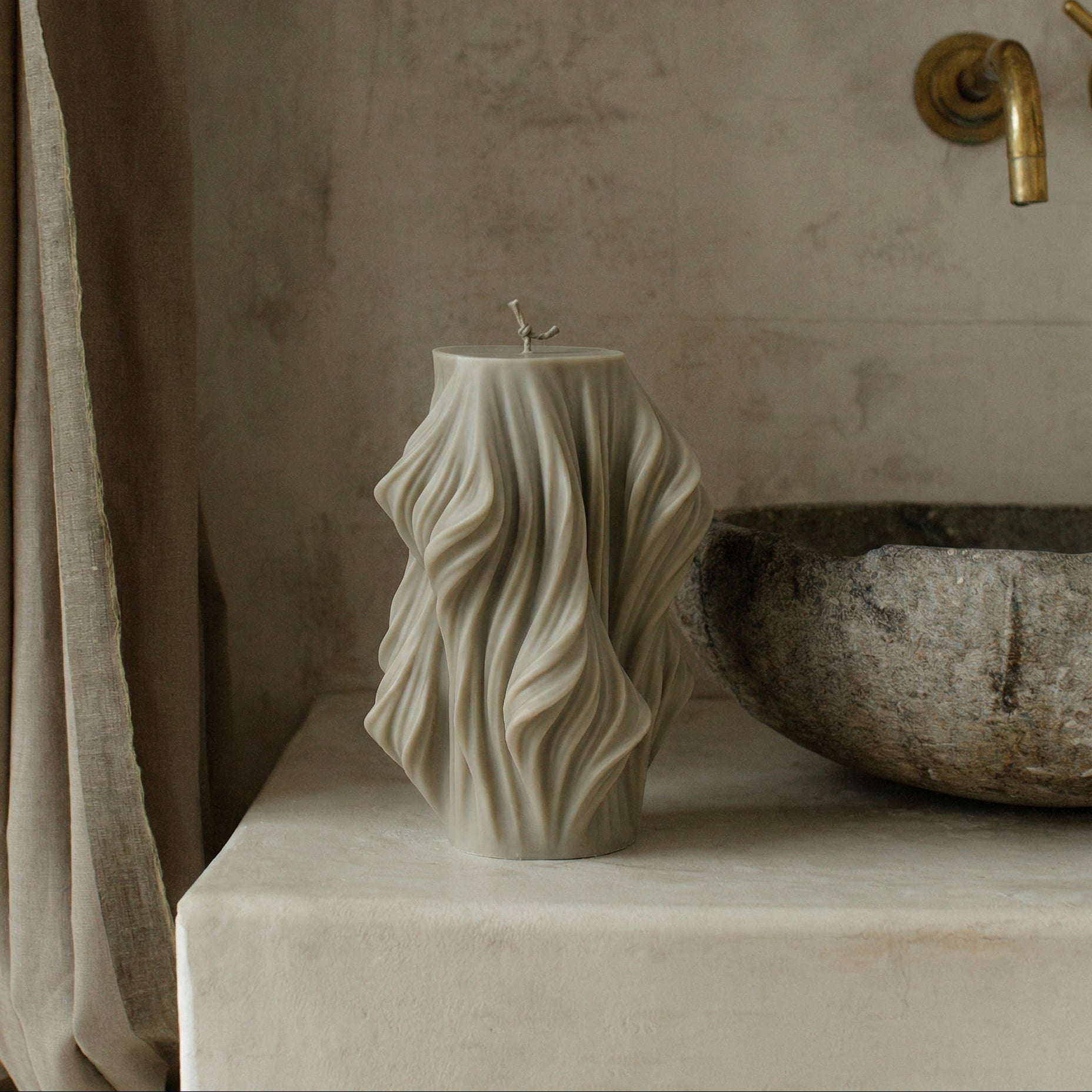 Close-up detail of handmade sculptural candle showing cascading wave texture in premium soy wax from Los Angeles