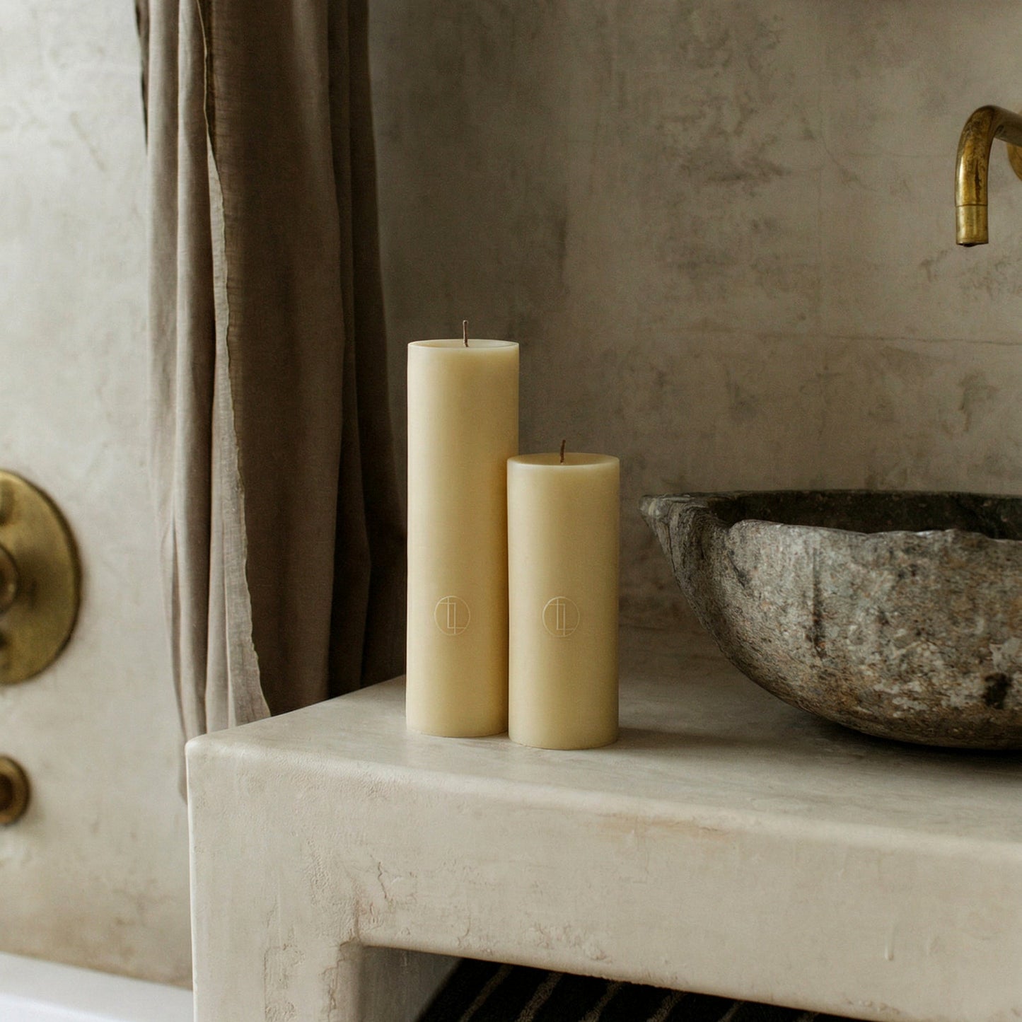 Handmade unscented cylinder candle detail showing smooth soy wax texture and cotton wick in minimalist setting