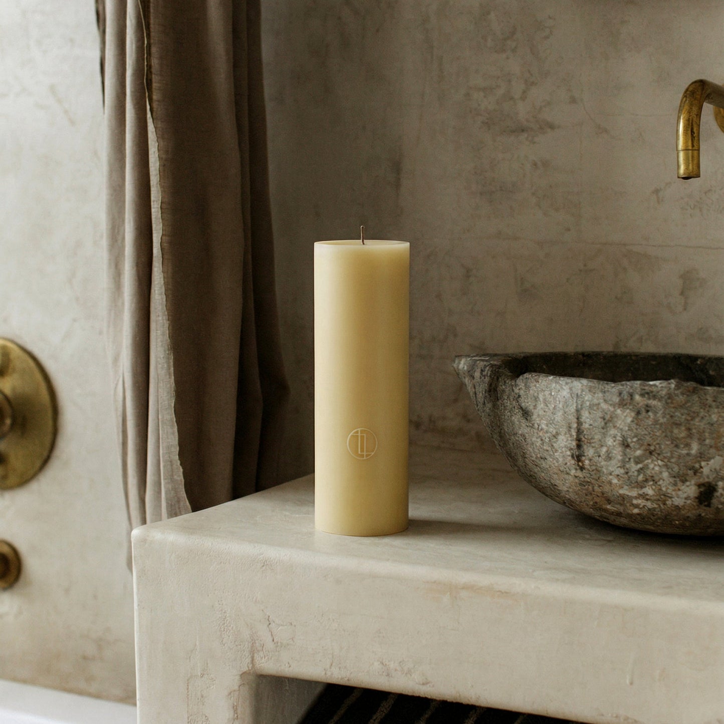 Close-up detail of handmade unscented cylinder candle showing smooth soy wax texture and cotton wick