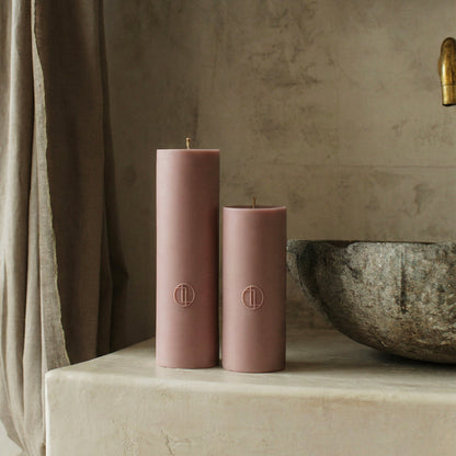 Close-up detail of handmade unscented cylinder candle showing smooth soy wax texture and cotton wick in Los Angeles studio