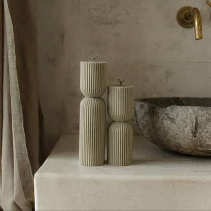 Close-up detail of handmade hourglass sculptural candle texture showing premium soy wax surface in natural light