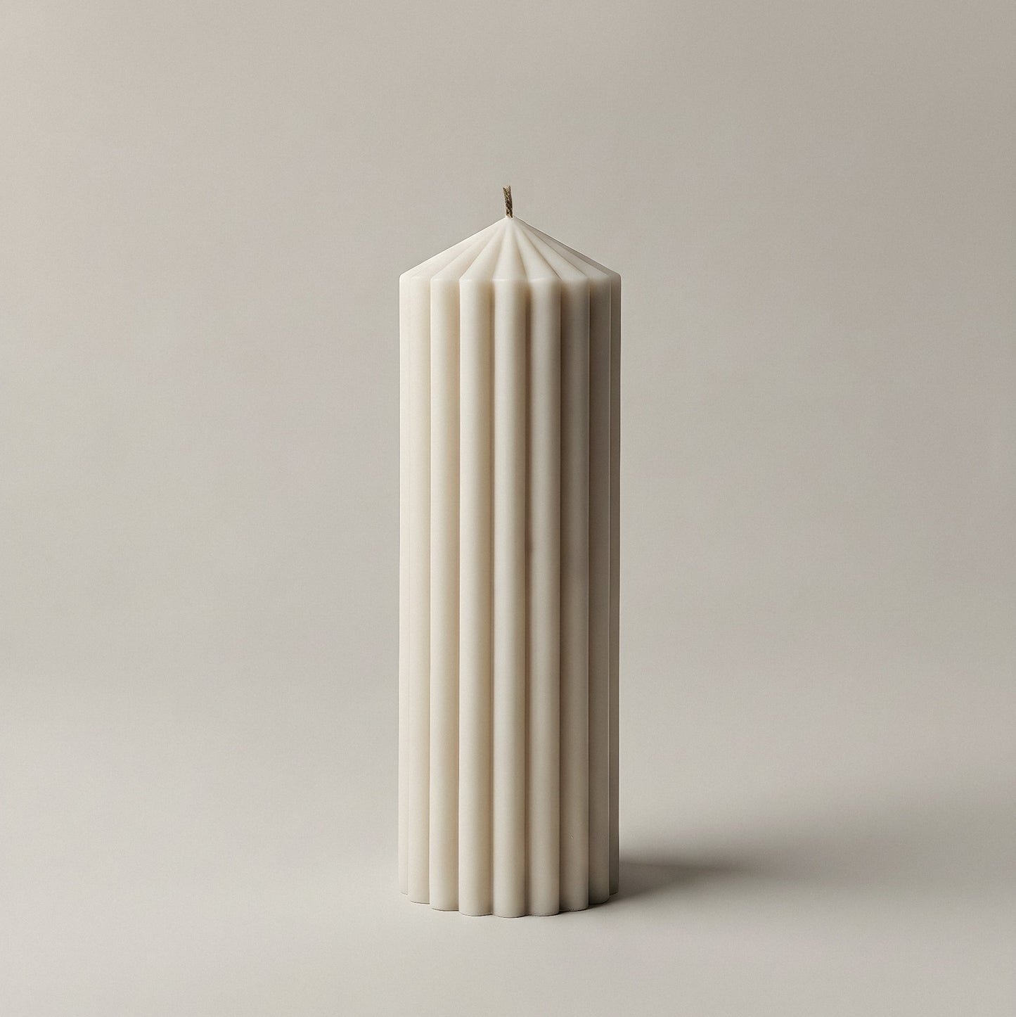 Close-up detail of handmade Peak sculptural candle showing premium soy wax texture and cotton wick