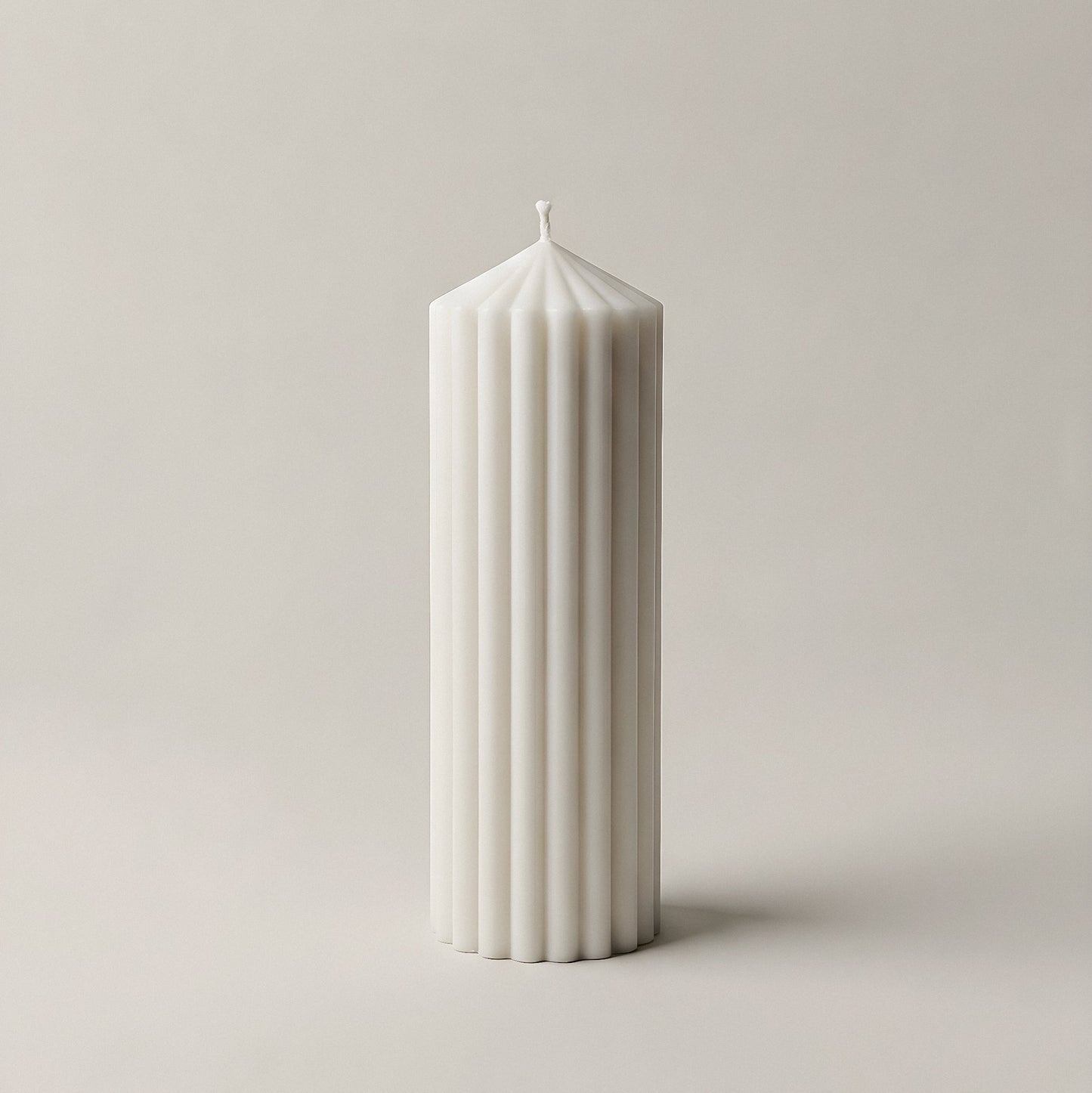 Close-up detail of handmade Peak sculptural candle showing smooth soy wax texture and natural cotton wick