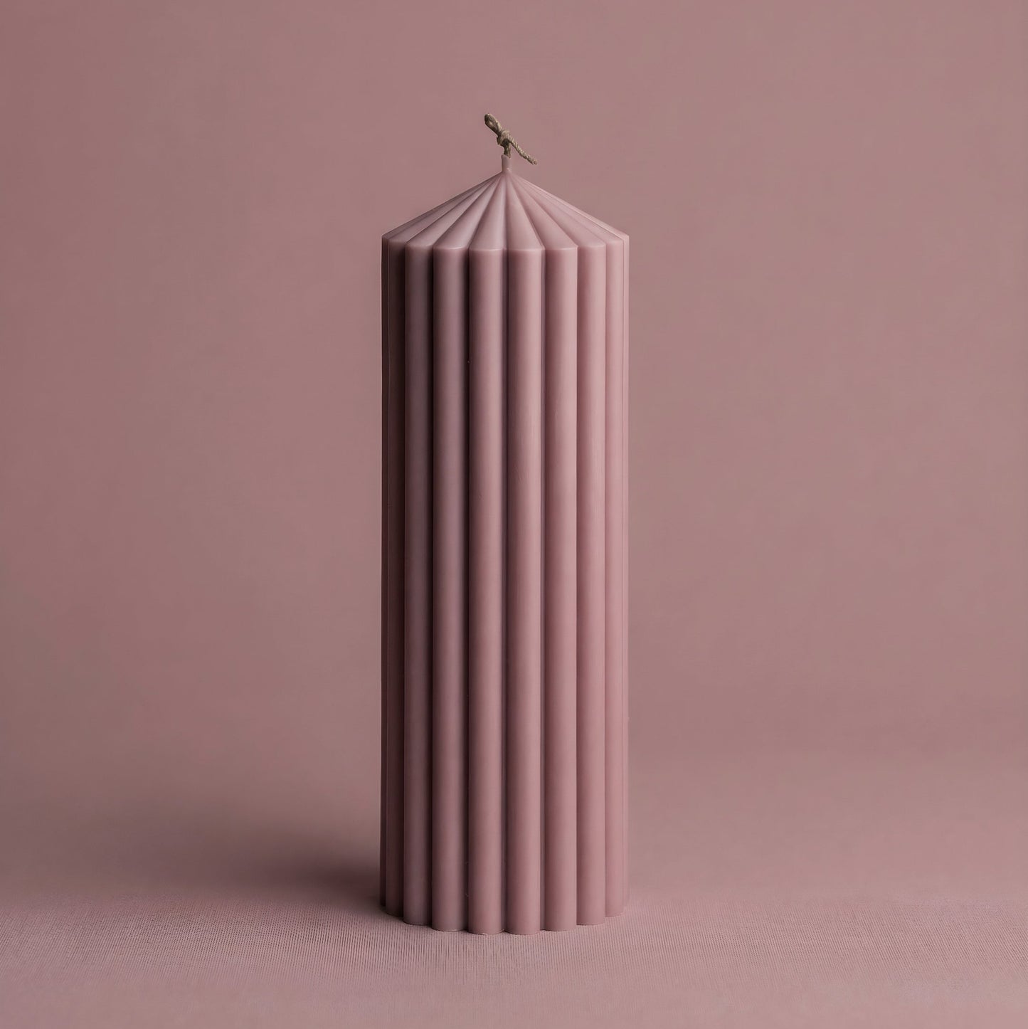 Close-up detail of handmade Peak sculptural candle showing premium soy wax texture and modern geometric design