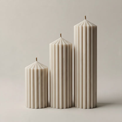 White sculptural Peak Candle handmade from unscented soy wax on neutral background