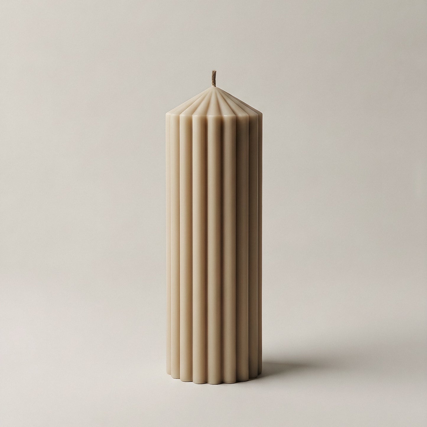 Peak sculptural candle handmade in Los Angeles displayed in modern interior with natural lighting and minimal decor