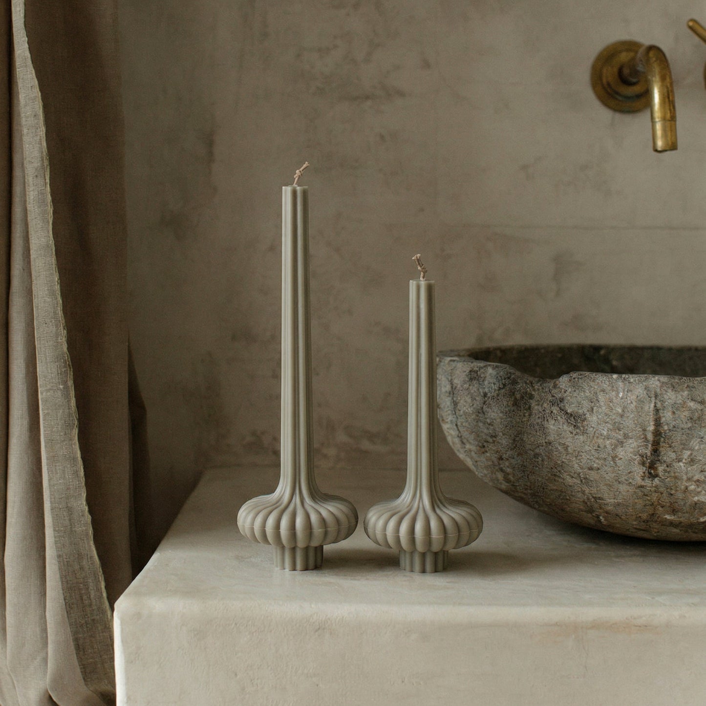 Close-up detail of handmade pumpkin sculptural candle showing textured soy wax surface and natural ridges