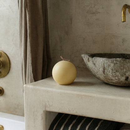 Handmade unscented sphere candle detail showing smooth soy wax texture and natural cotton wick in Los Angeles studio