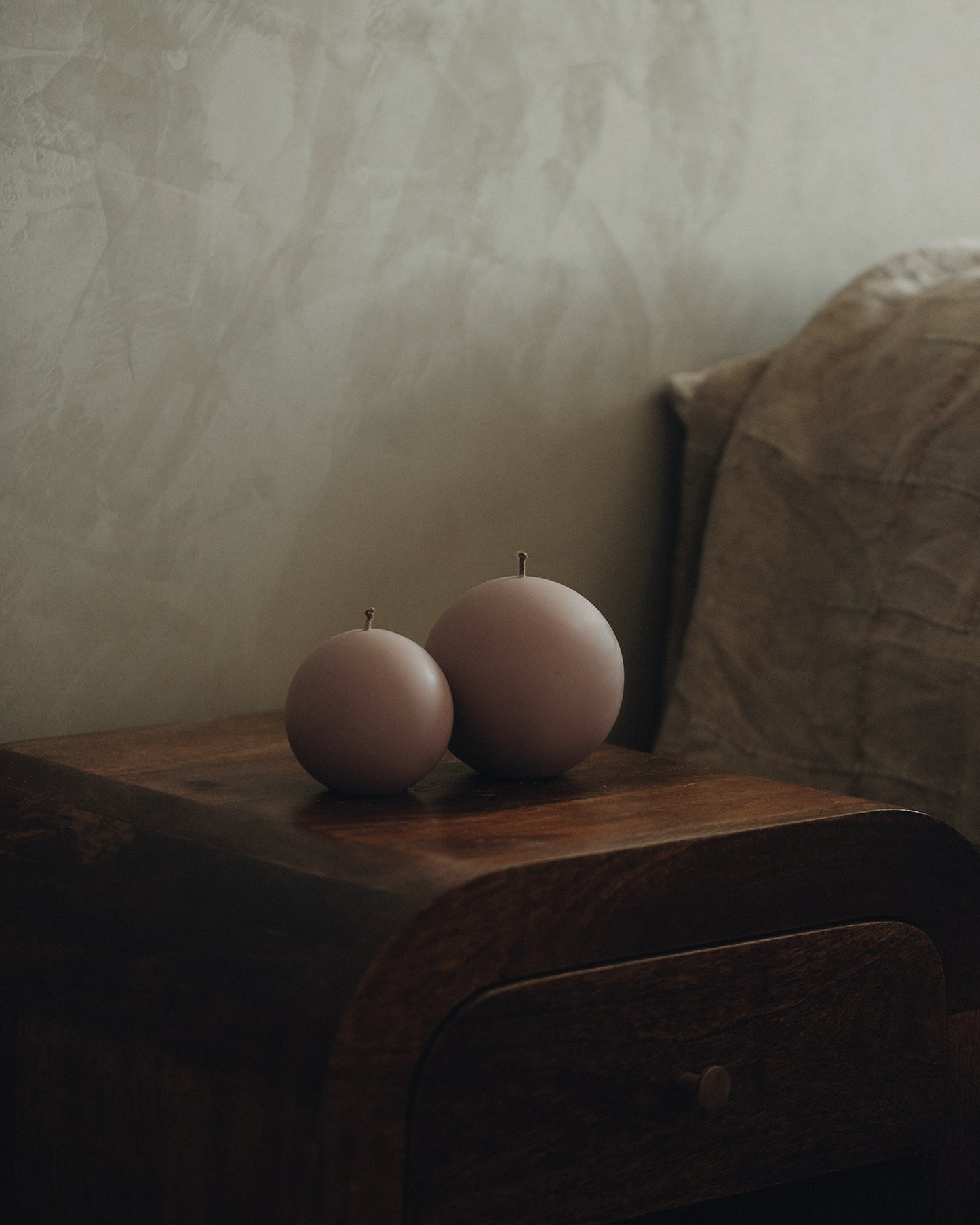 LAWA Candles Sphere Candle, set of 2, in Dusty Rose soy wax styled in a home decor setting, alternate angle