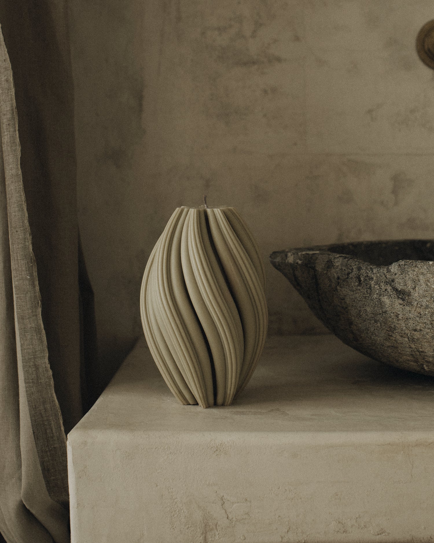 LAWA Candles Swirl Candle, large, in Olive Beige soy wax styled in a home decor setting, alternate angle
