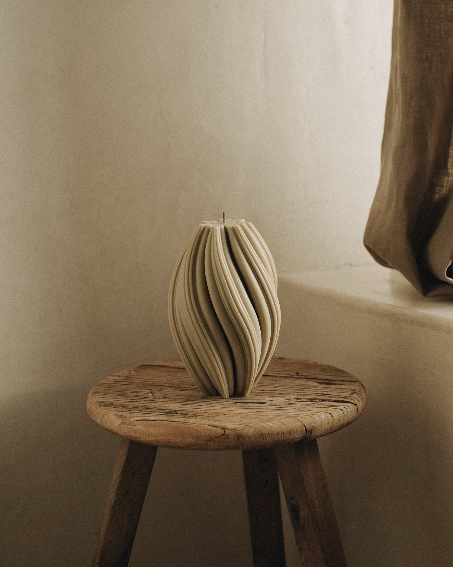 LAWA Candles Swirl Candle, large, in Olive Beige soy wax styled in a home decor setting