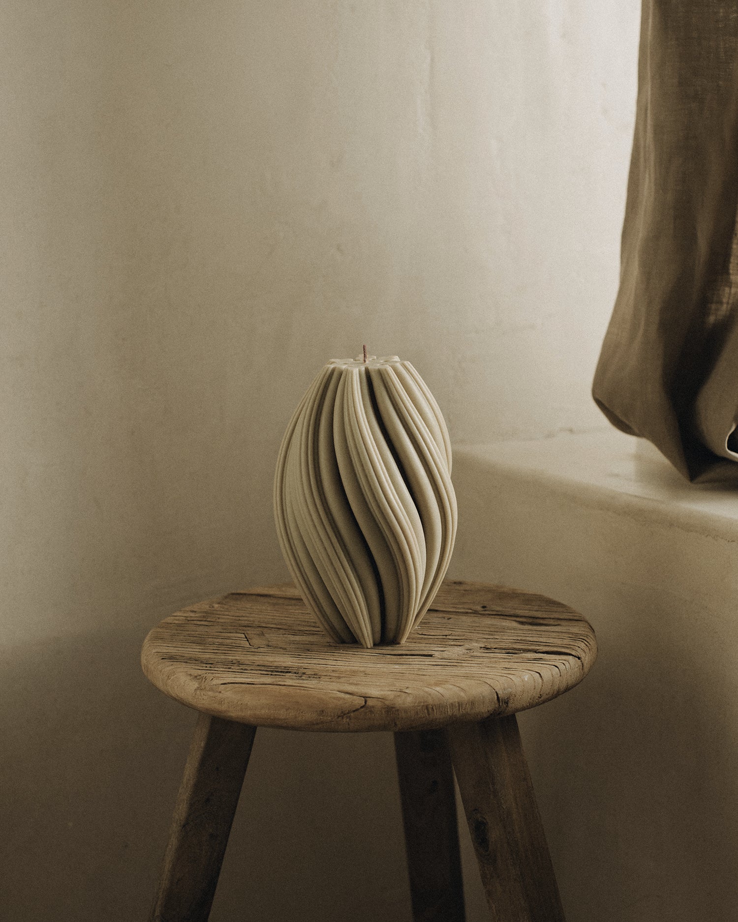 LAWA Candles Swirl Candle, large, in Olive Beige soy wax styled in a home decor setting