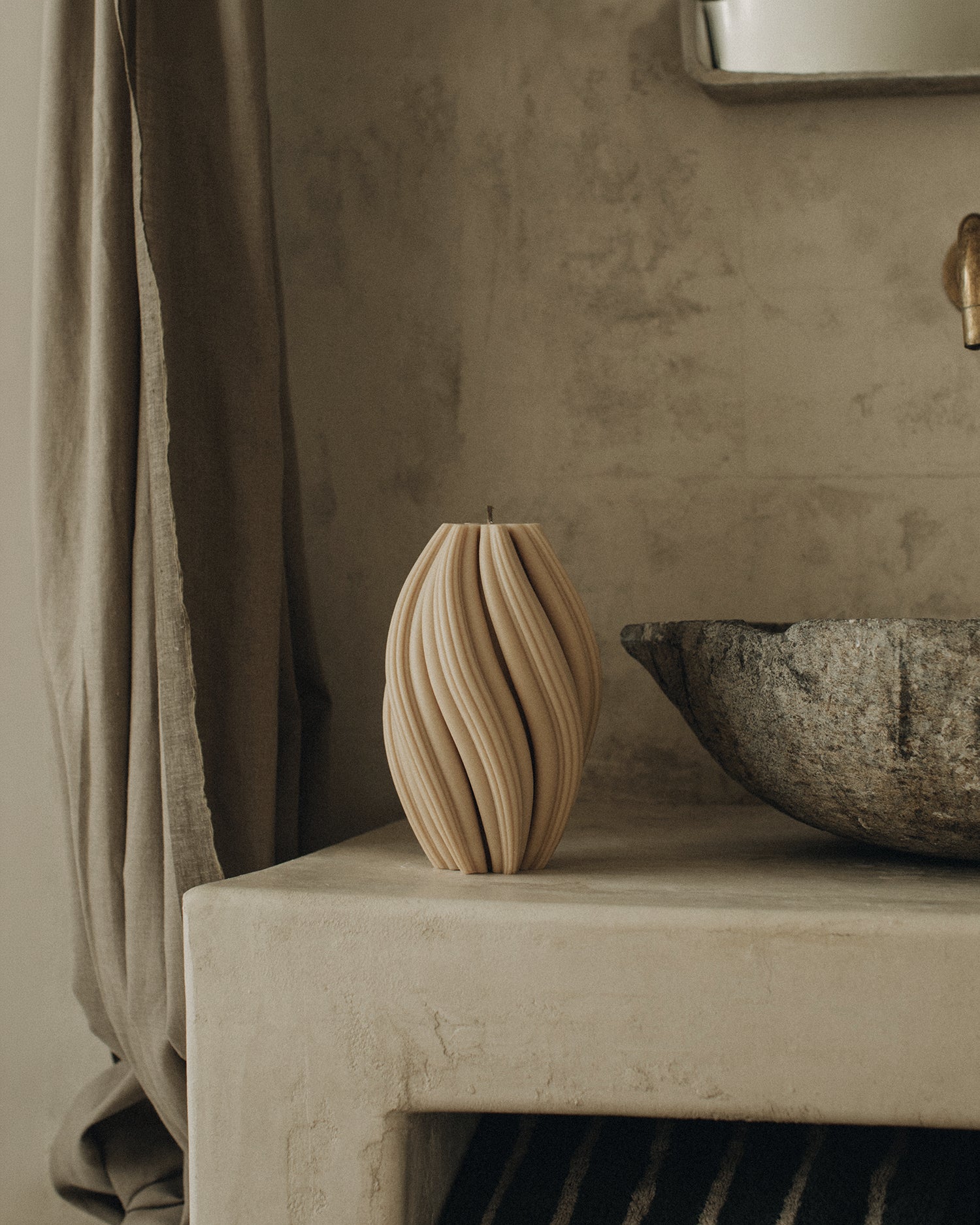 LAWA Candles Swirl Candle, large, in Sandstone soy wax styled in a home decor setting, alternate angle