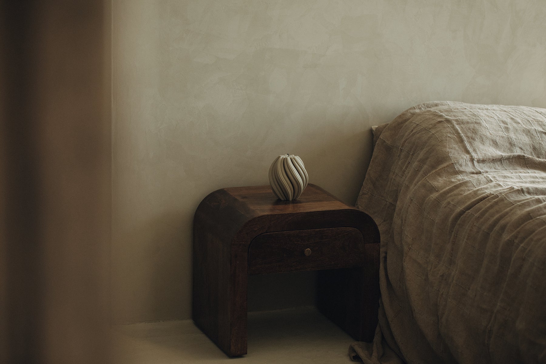 LAWA Candles Swirl Candle, medium, in Jade soy wax styled in a home decor setting, horizontal shot