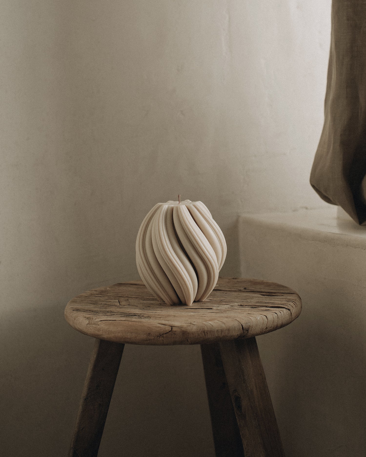 LAWA Candles Swirl Candle, medium, in Moon Gray soy wax styled in a home decor setting