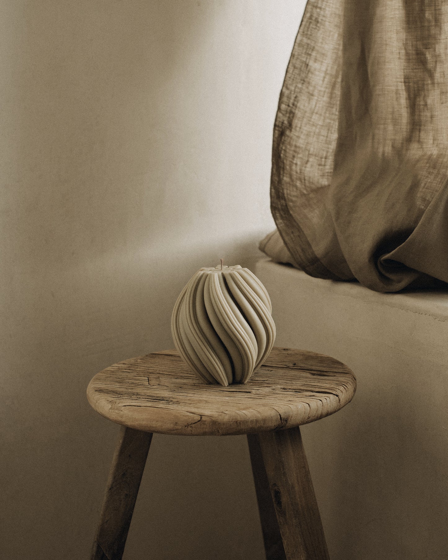 LAWA Candles Swirl Candle, medium, in Olive Beige soy wax styled in a home decor setting
