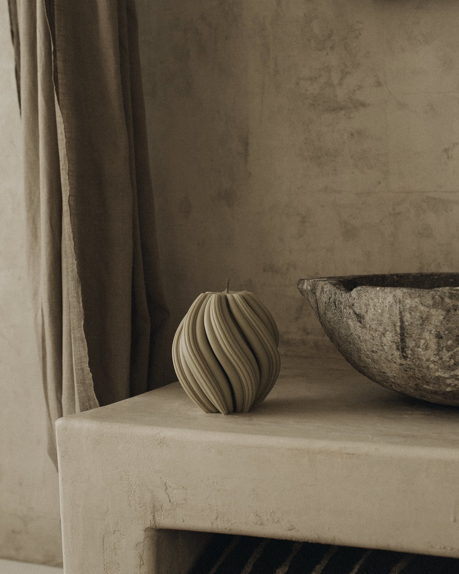 LAWA Candles Swirl Candle, medium, in Olive Beige soy wax styled in a home decor setting, alternate angle
