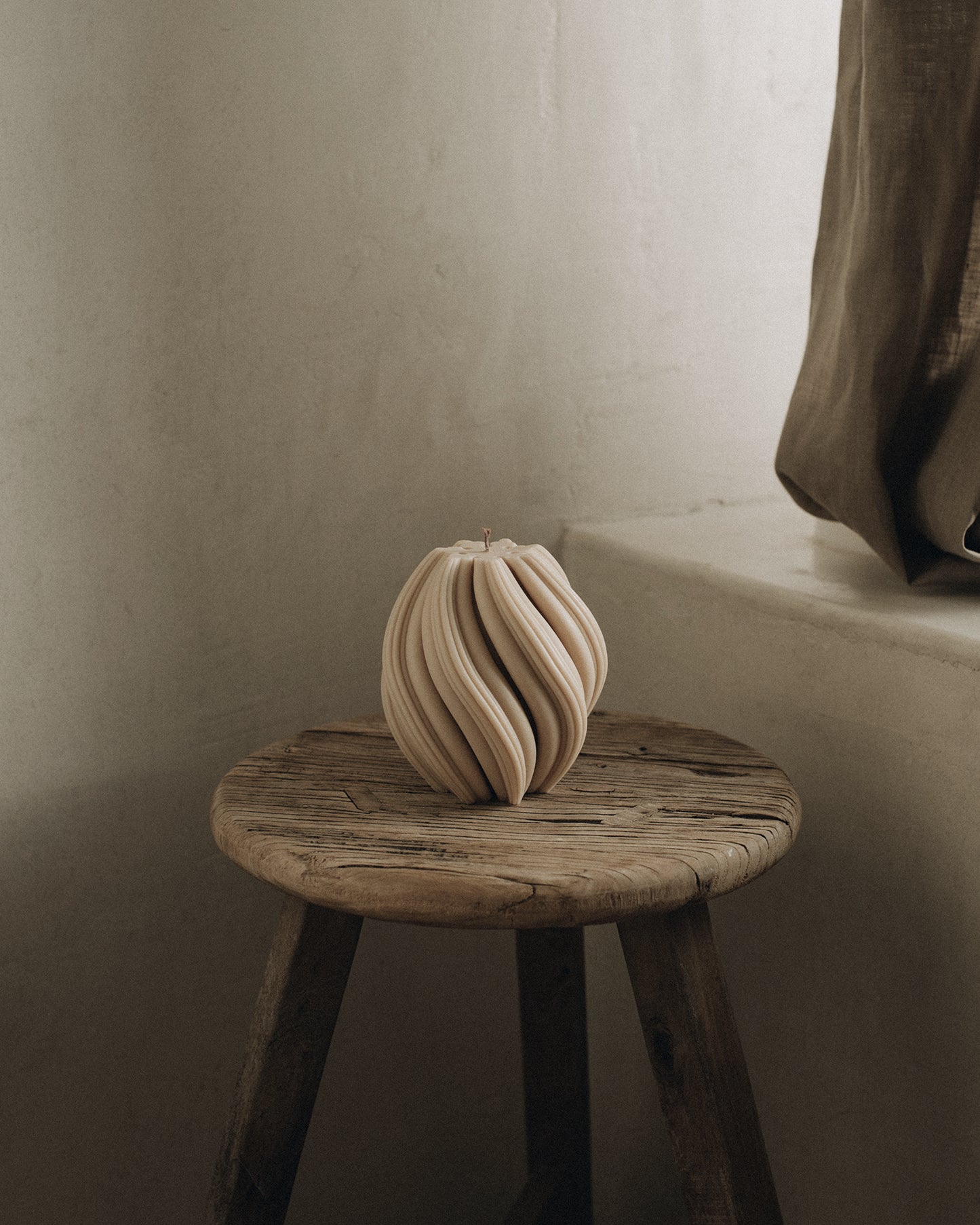 LAWA Candles Swirl Candle, medium, in Sandstone soy wax styled in a home decor setting