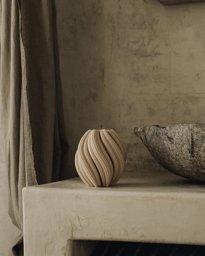 LAWA Candles Swirl Candle, medium, in Sandstone soy wax styled in a home decor setting, alternate angle